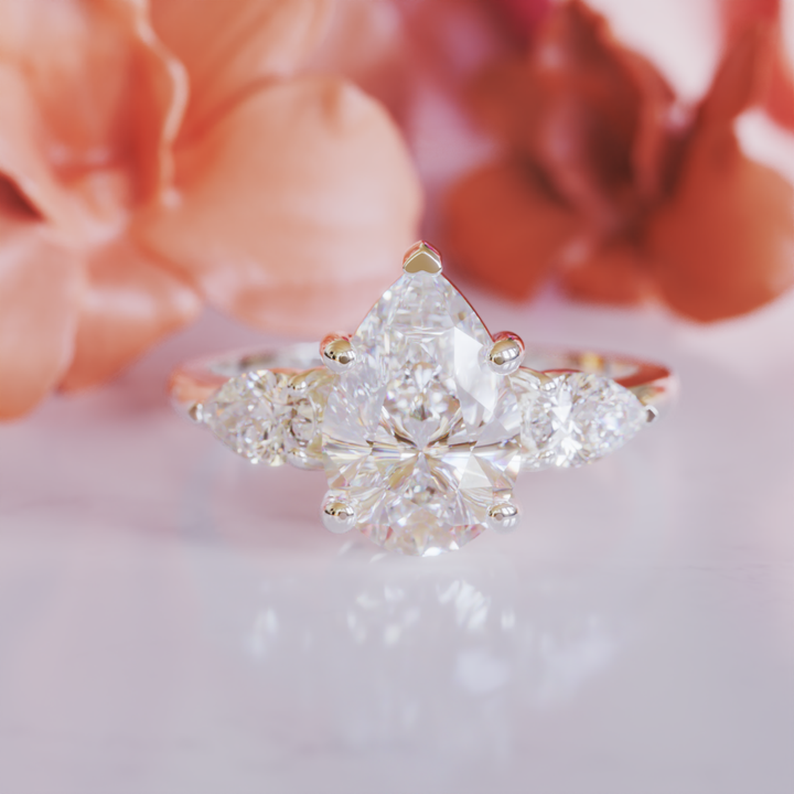 The Nola Ring™ Colored Gem Stone – Radiant Grace in a Triple-Stone Teardrop Design