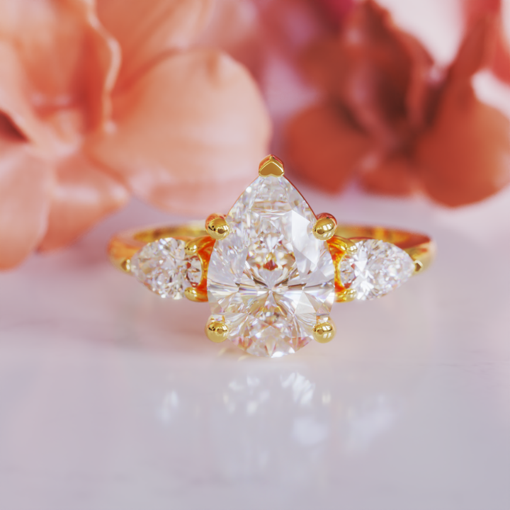 The Nola Ring™ Colored Gem Stone – Radiant Grace in a Triple-Stone Teardrop Design
