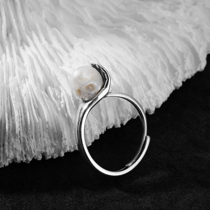 Cranium Pearl In Hand Ring™ Skull Accessories  - Adjustable Retro Ring with Pearl Skull in Sculpted Hand