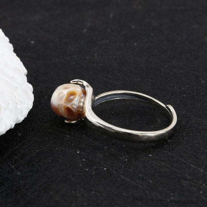 Cranium Pearl In Hand Ring™ Skull Accessories  - Adjustable Retro Ring with Pearl Skull in Sculpted Hand