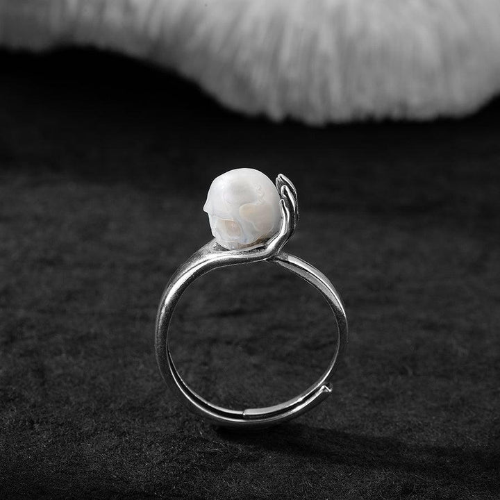 Cranium Pearl In Hand Ring™ Skull Accessories  - Adjustable Retro Ring with Pearl Skull in Sculpted Hand