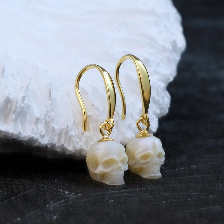 Tapered Pearl Skull Dangle Hook Earrings™ Skull Accessories – Gold-Plated Hook Earrings with Carved Pearl Skull Charms